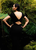 Lifestyle image of model showing the back details of the Be Right Back Dress